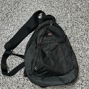 Tumi cross body backpack